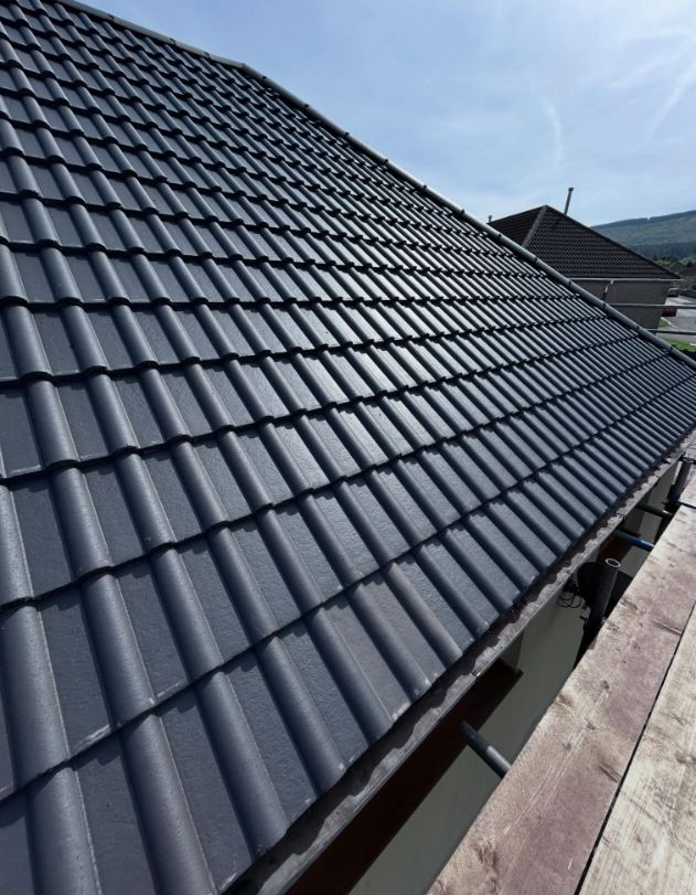 Close-up of new grey concrete roof tiles