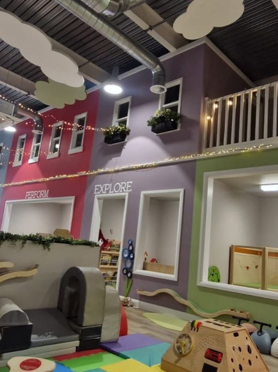 Dream Street children's play space with colourful timber-framed shopfronts