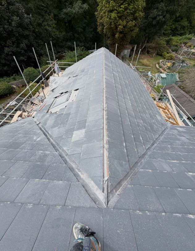 Slate roof with lead-lined valley during installation
